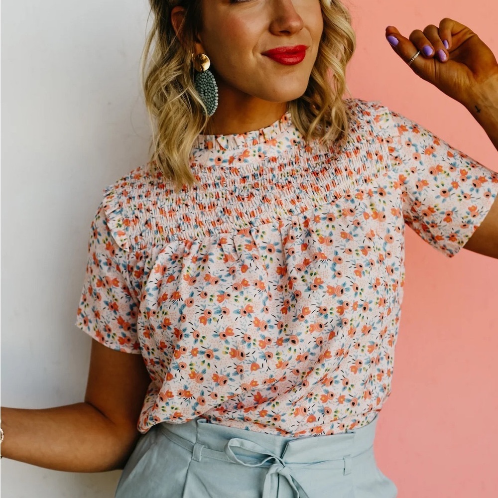 The Breece Floral Smocked Blouse size large from the Mod Boutique